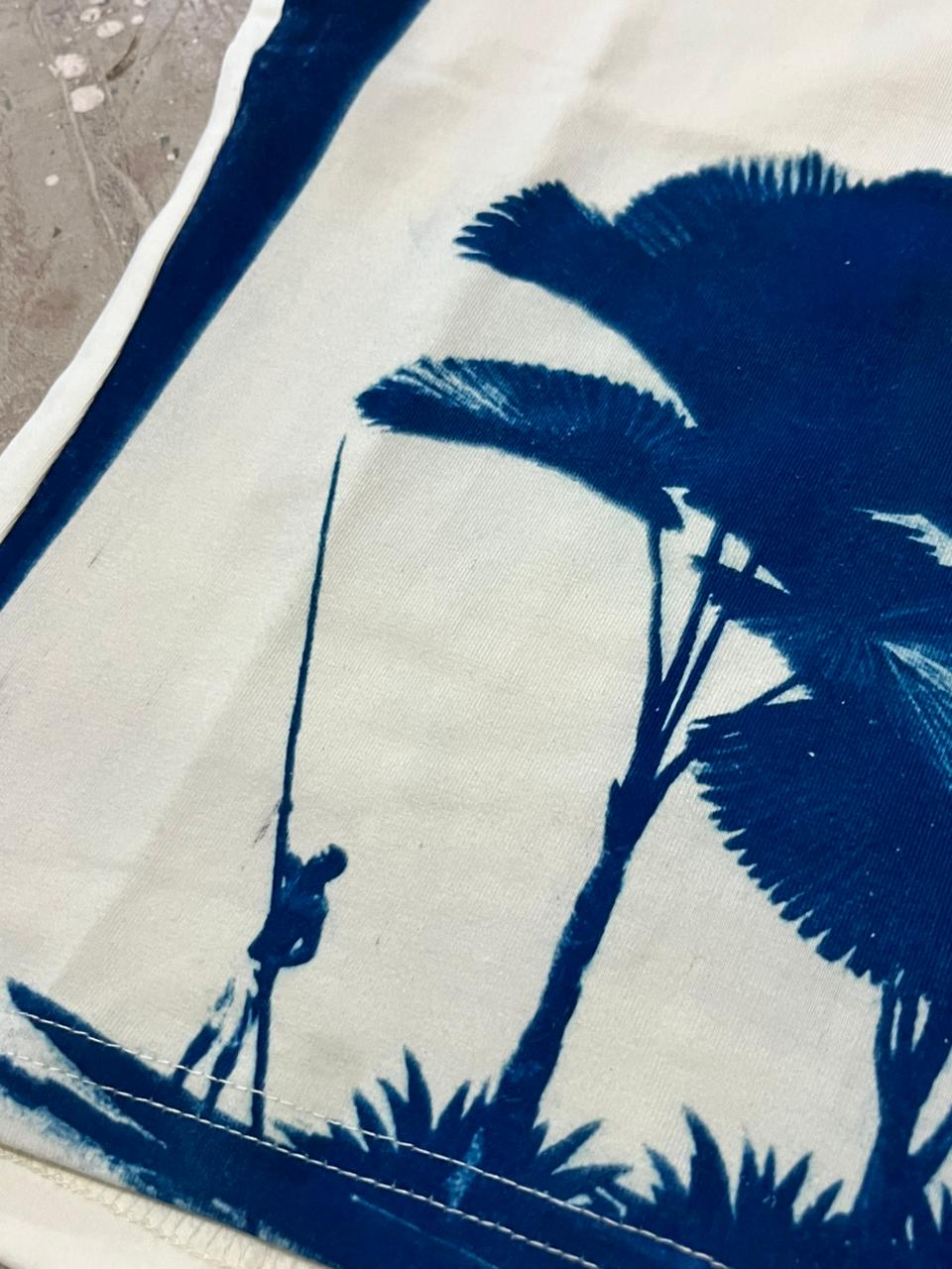 Blue silhouette of a person on a boat with a palm tree on a white background, wearable art piece, tank top, tops, fashion, art