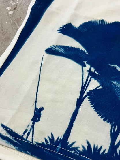 Blue silhouette of a person on a boat with a palm tree on a white background, wearable art piece, tank top, tops, fashion, art 